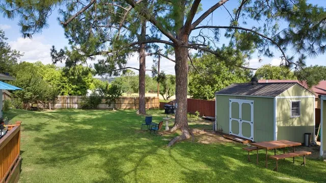 a view of backyard of a house