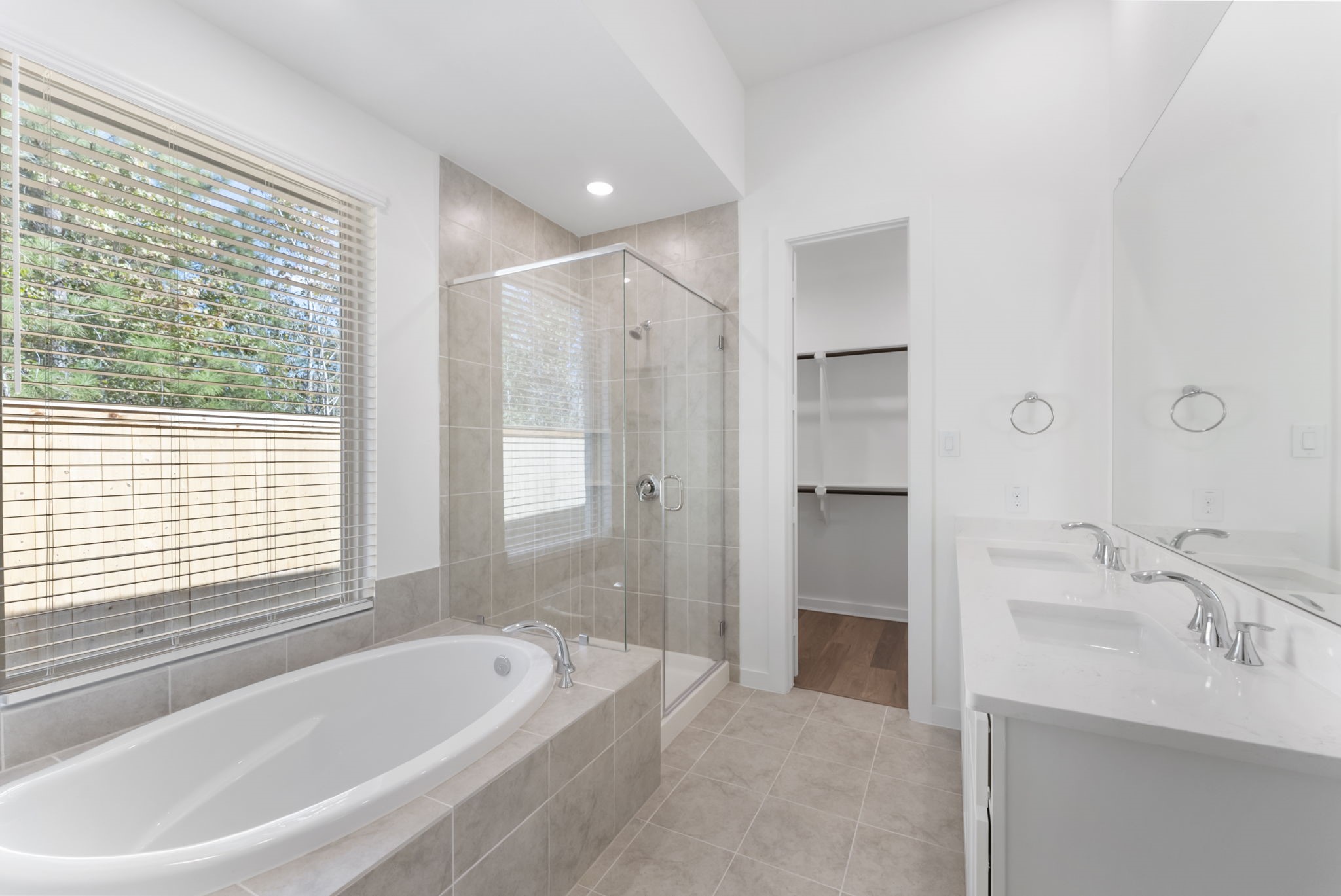 26383 Golden Pass Loop Montgomery, TX 77316 - Photo 30 of 40 a spacious bathroom with a bathtub and a sink
