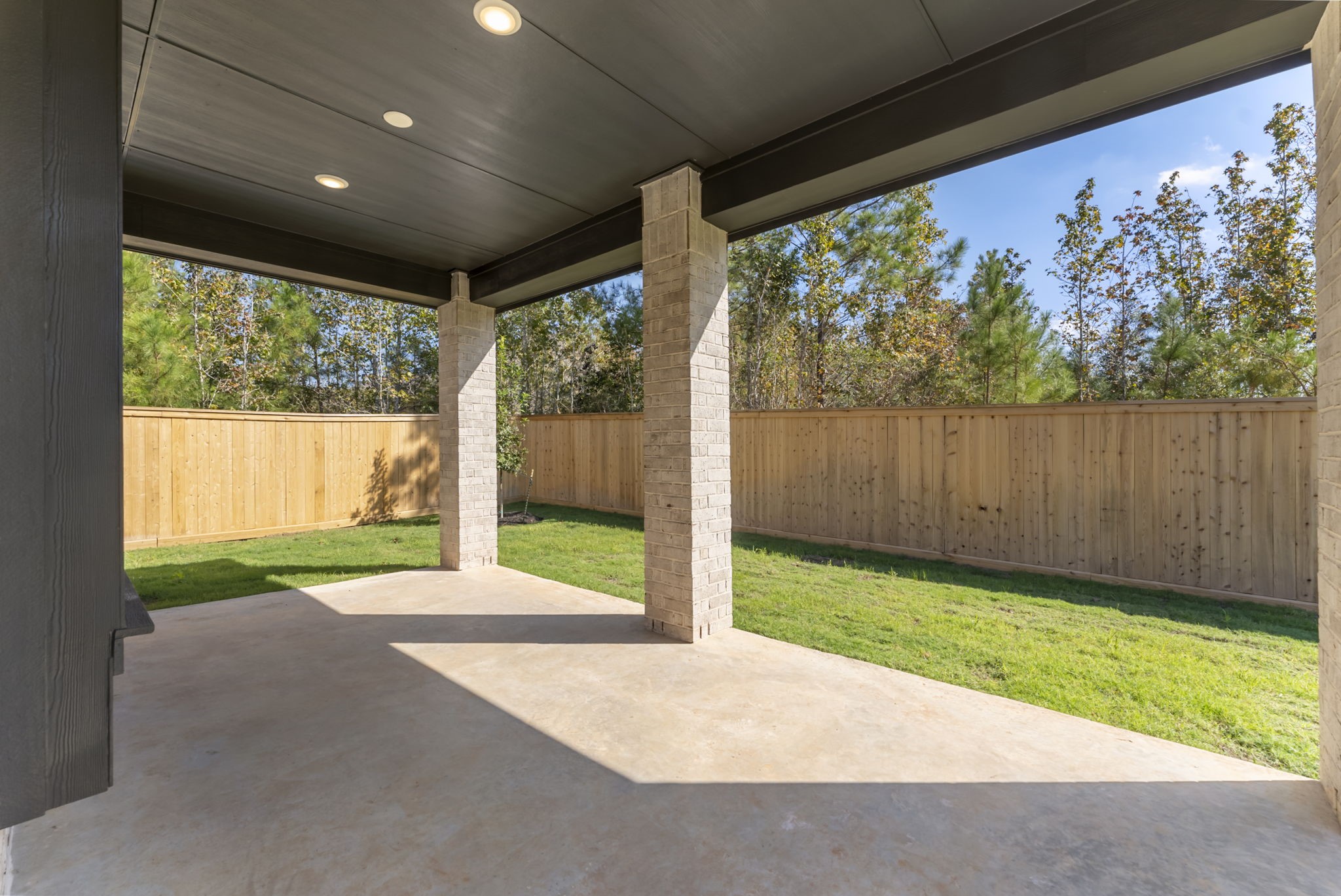 26383 Golden Pass Loop Montgomery, TX 77316 - Photo 33 of 40 a view of a porch with a yard
