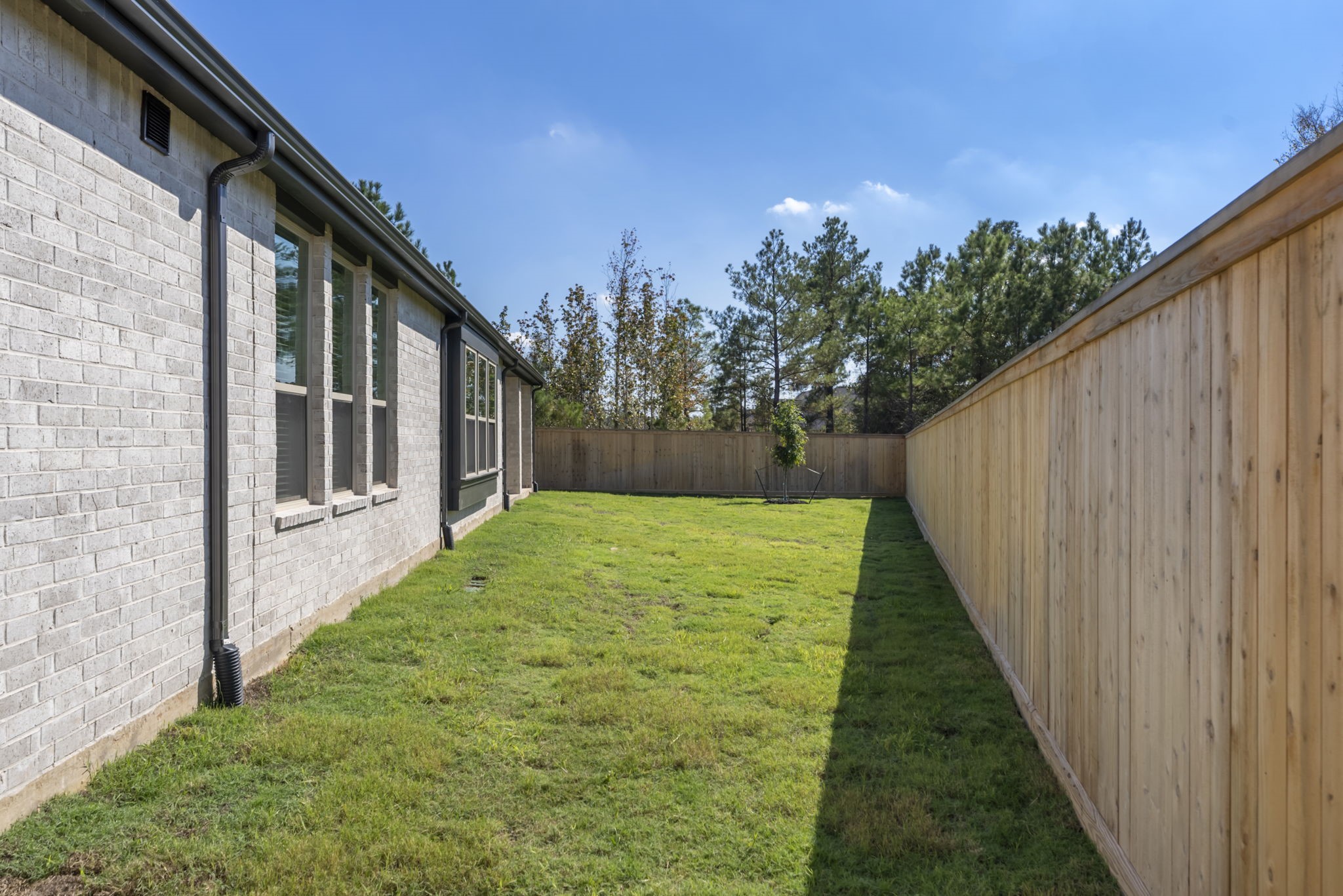 26383 Golden Pass Loop Montgomery, TX 77316 - Photo 37 of 40 a backyard of a house with lots of green space