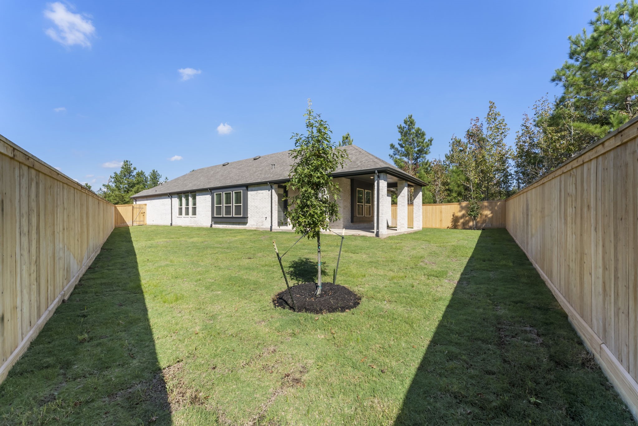26383 Golden Pass Loop Montgomery, TX 77316 - Photo 38 of 40 a front view of a house with a yard