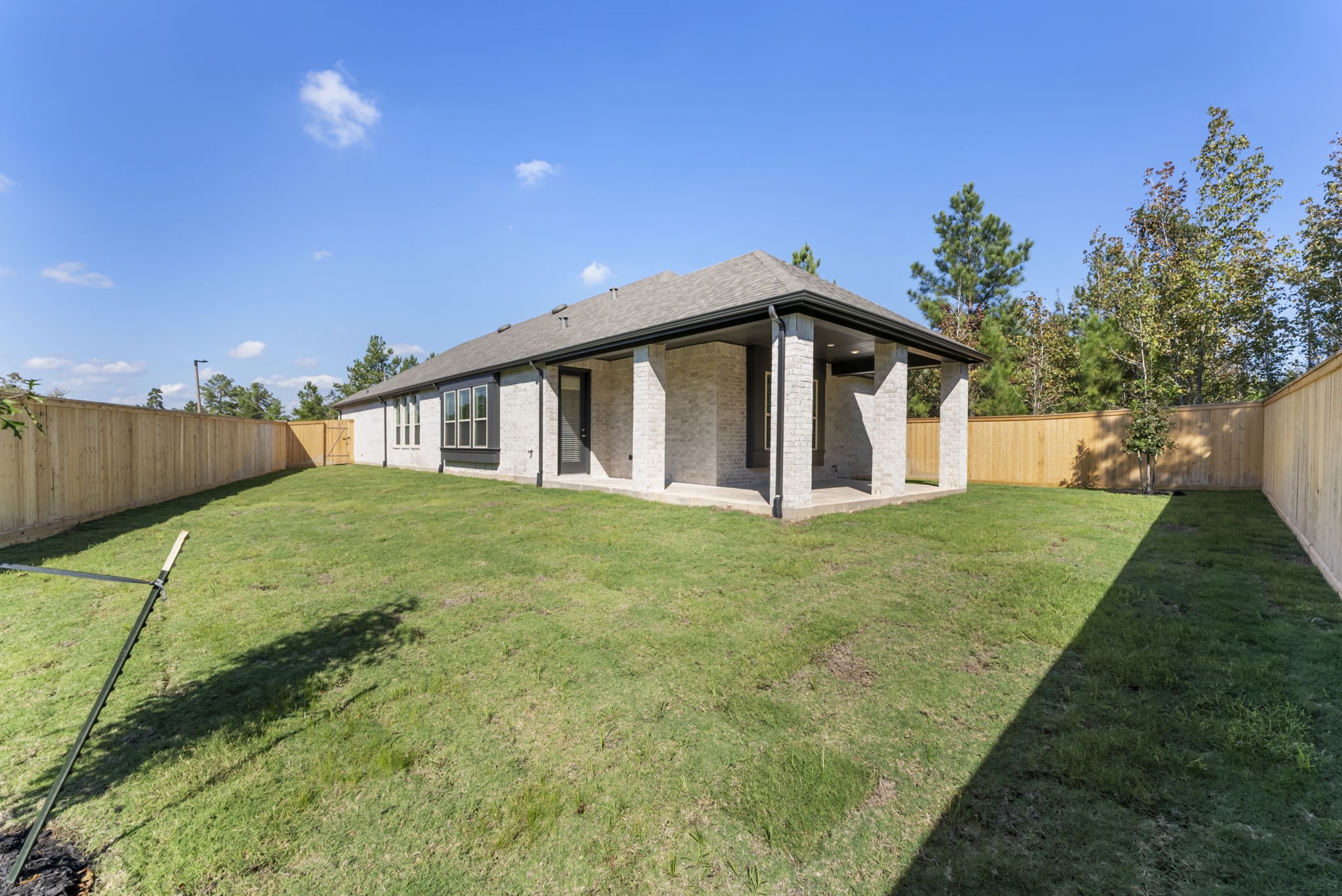 26383 Golden Pass Loop Montgomery, TX 77316 - Photo 39 of 40 a view of a house with a backyard