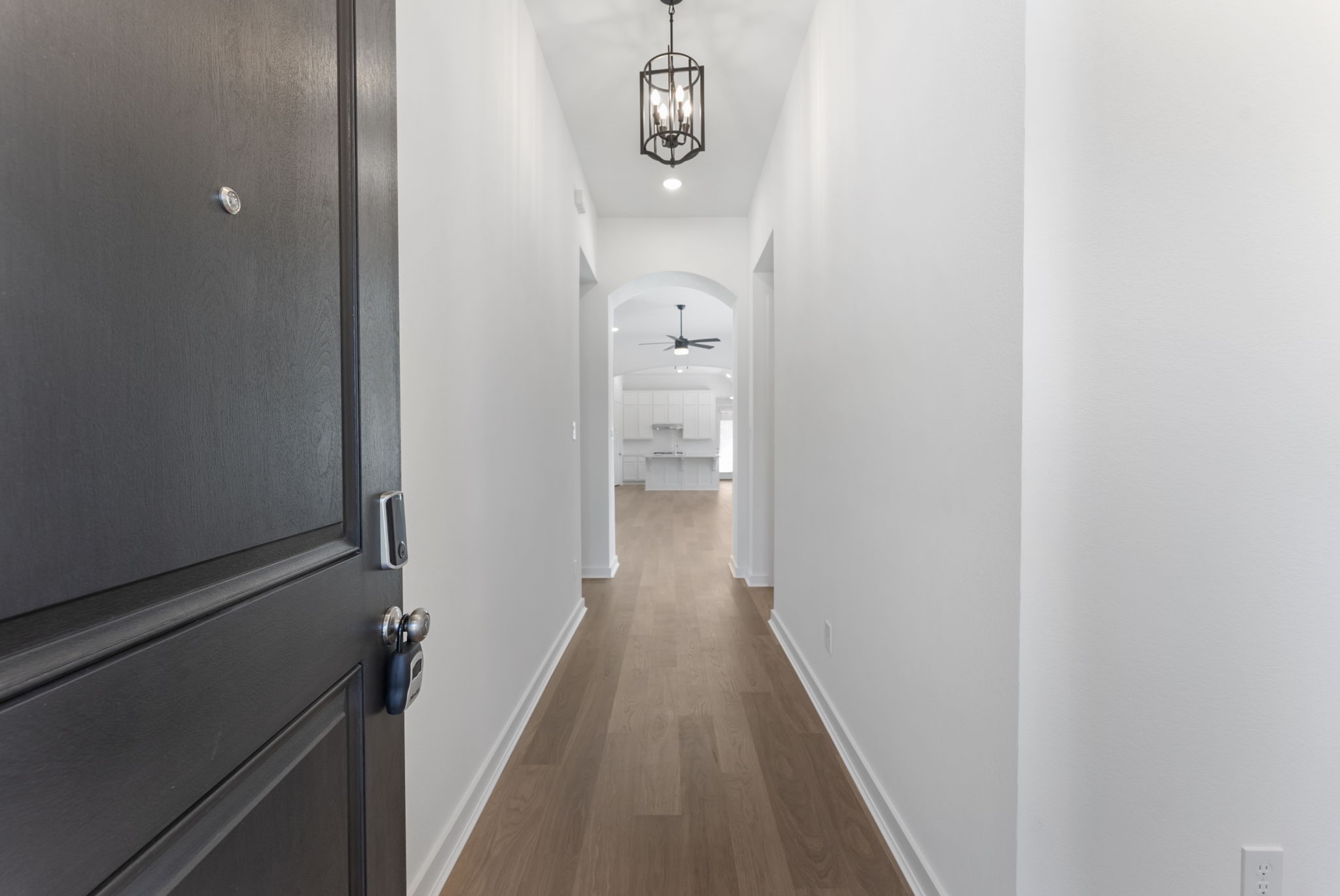 26383 Golden Pass Loop Montgomery, TX 77316 - Photo 4 of 40 a view of a hallway with wooden floor