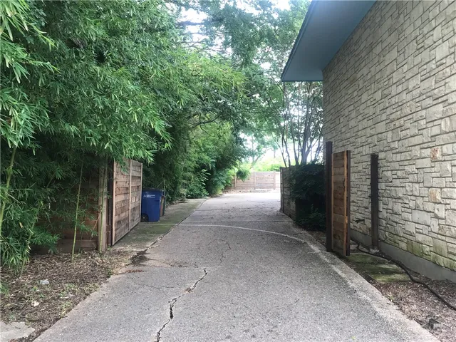 a view of a house with a tree