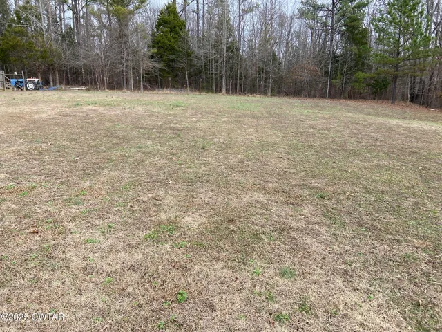 a view of wall with wooden fence