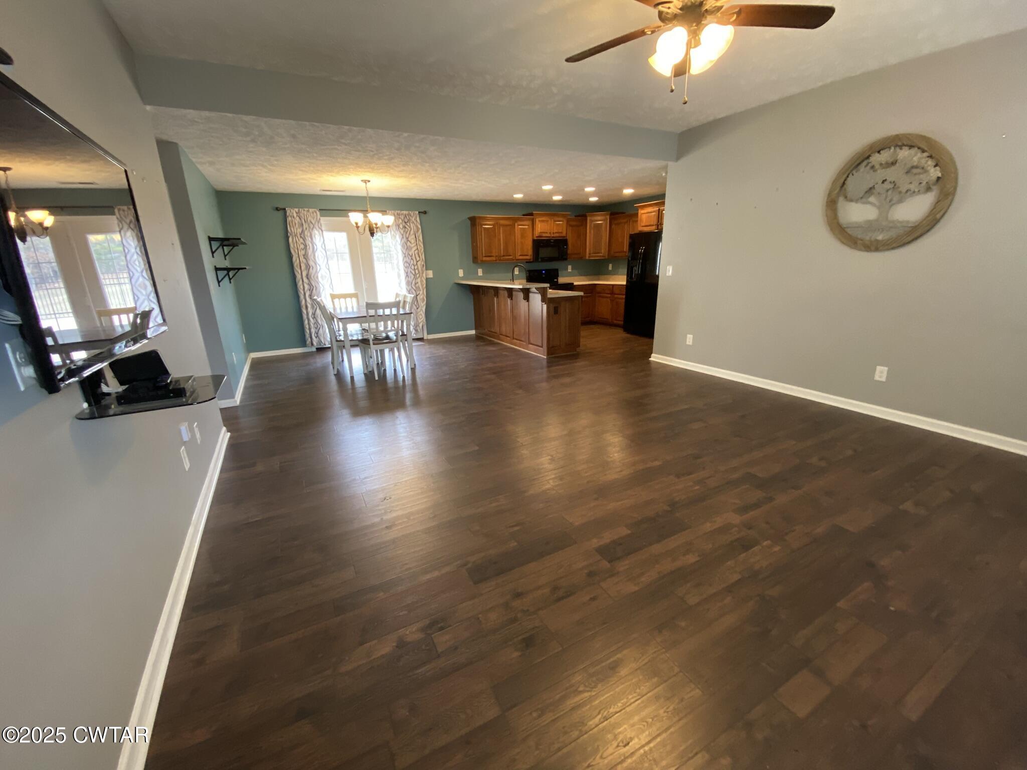 90 Timber Ridge Cove Henderson, TN 38340 - Photo 13 of 30 a view of a room with furniture and wooden floor