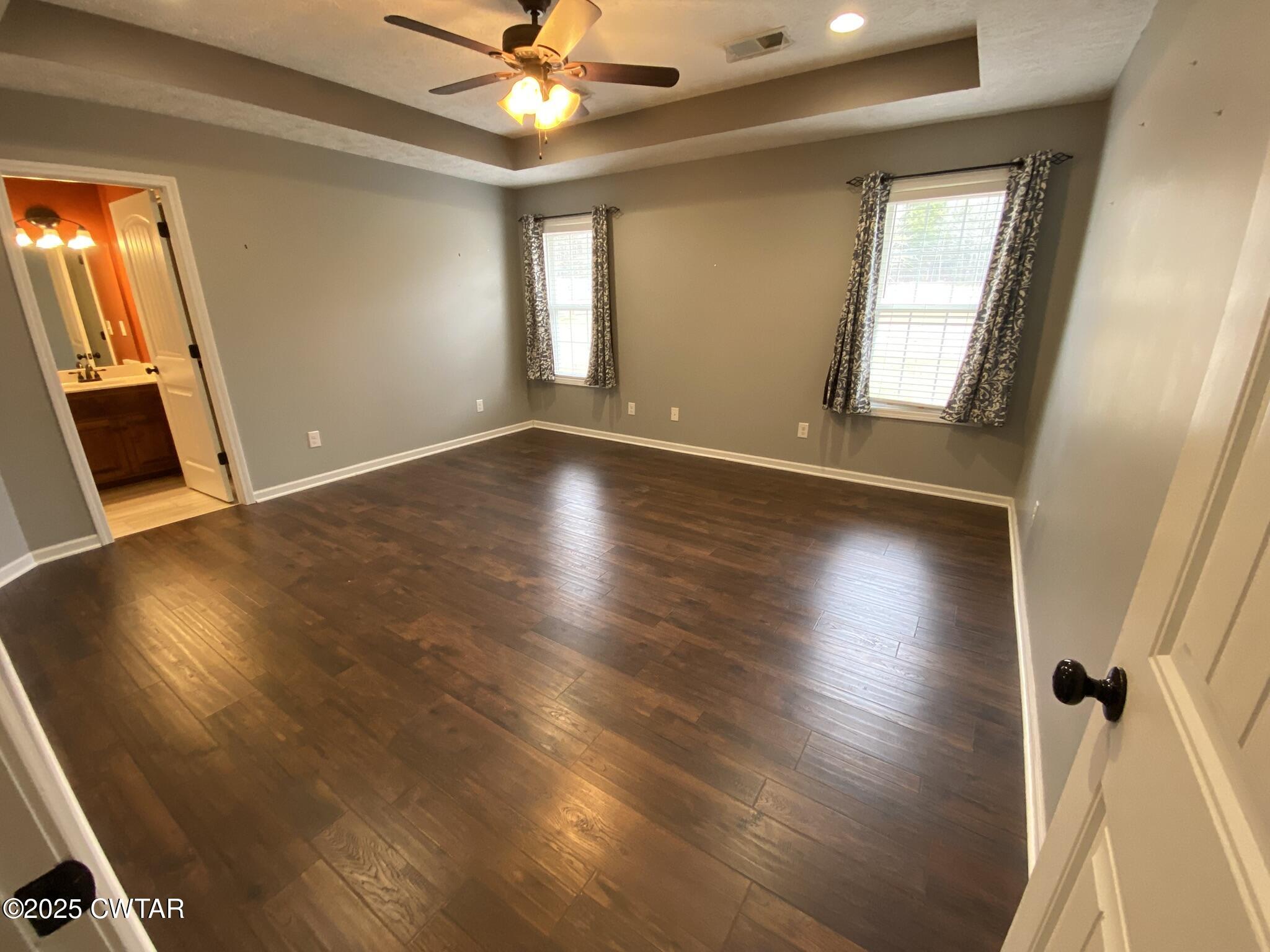 90 Timber Ridge Cove Henderson, TN 38340 - Photo 17 of 30 wooden floor in an empty room with a window