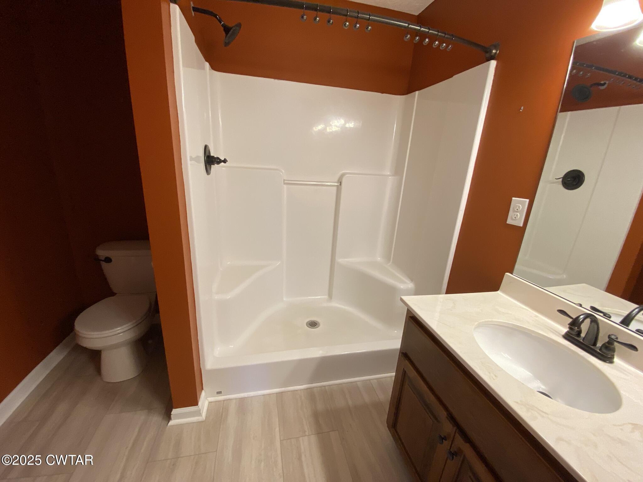 90 Timber Ridge Cove Henderson, TN 38340 - Photo 19 of 30 a bathroom with a sink a toilet and shower