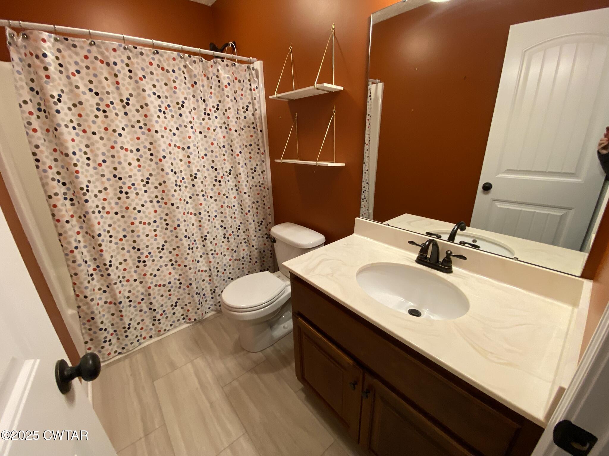 90 Timber Ridge Cove Henderson, TN 38340 - Photo 24 of 30 a bathroom with a sink toilet and shower