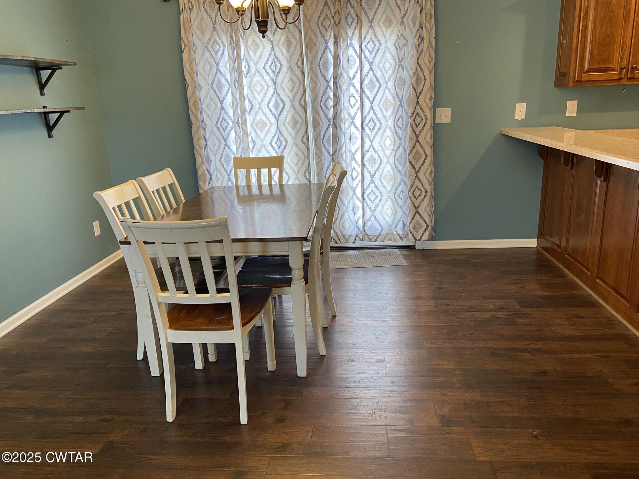 90 Timber Ridge Cove Henderson, TN 38340 - Photo 26 of 30 a dining room with furniture and wooden floor