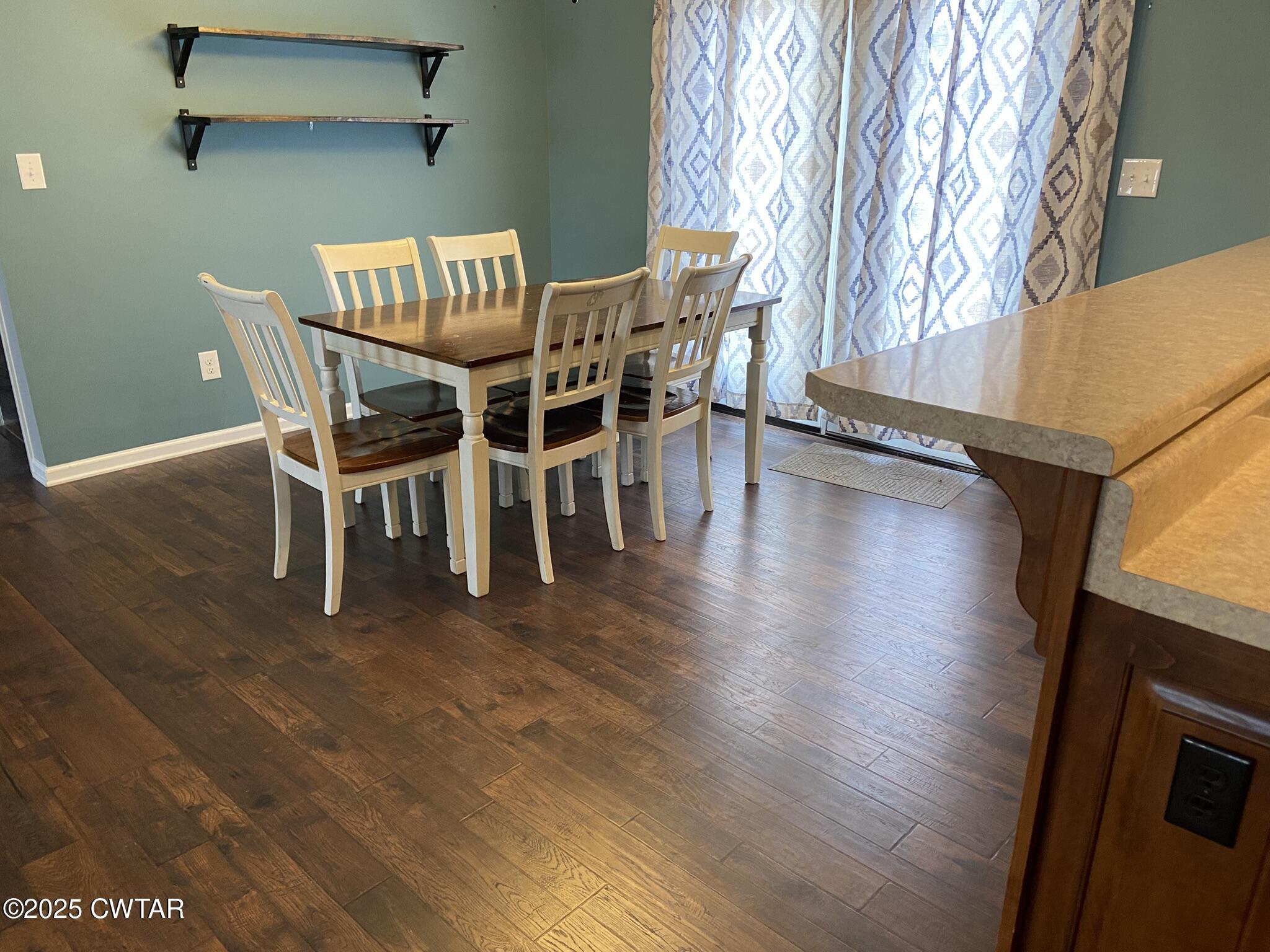 90 Timber Ridge Cove Henderson, TN 38340 - Photo 28 of 30 a dining room with furniture and wooden floor