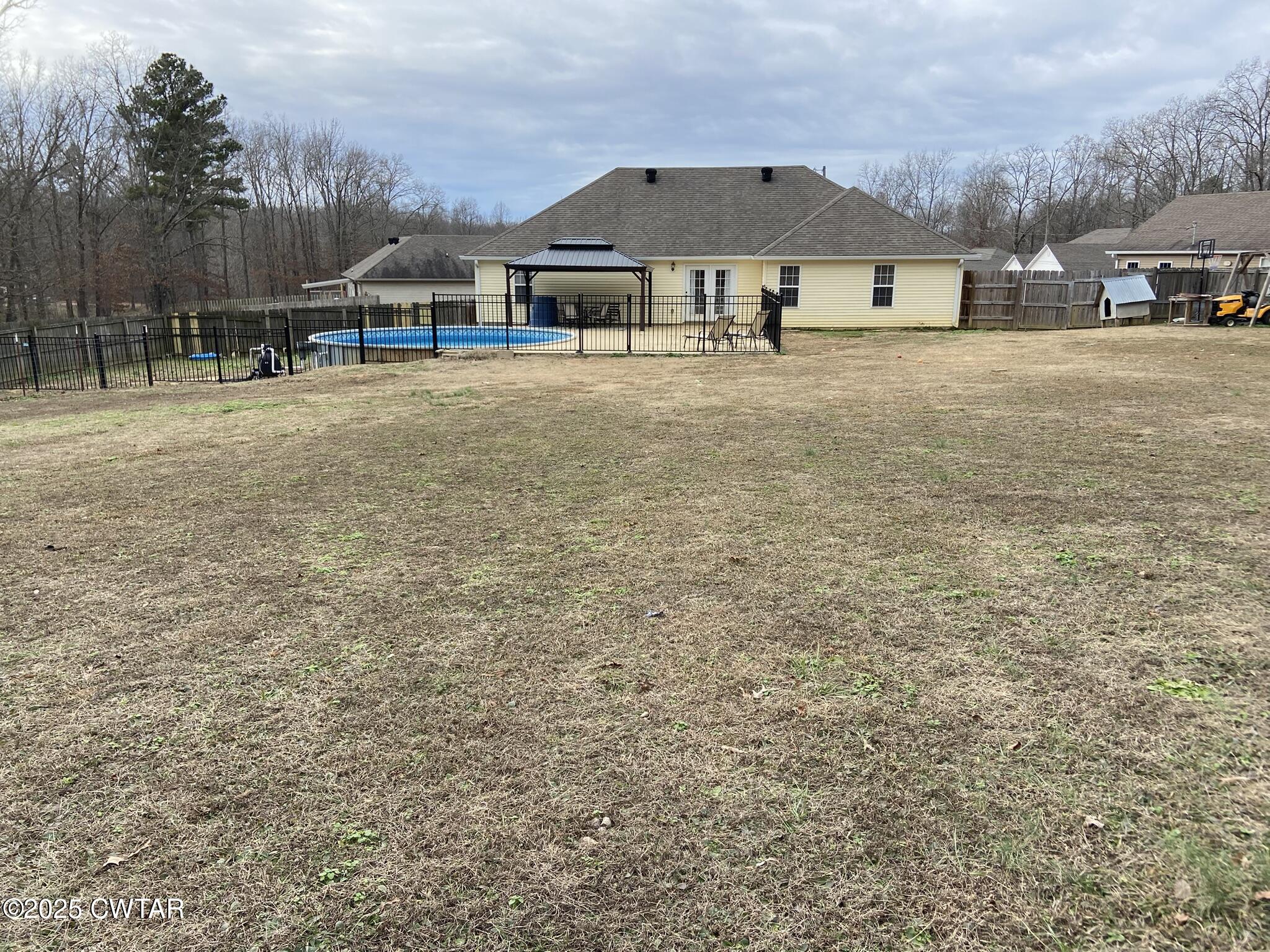 90 Timber Ridge Cove Henderson, TN 38340 - Photo 7 of 30 a front view of a house with a yard and trees