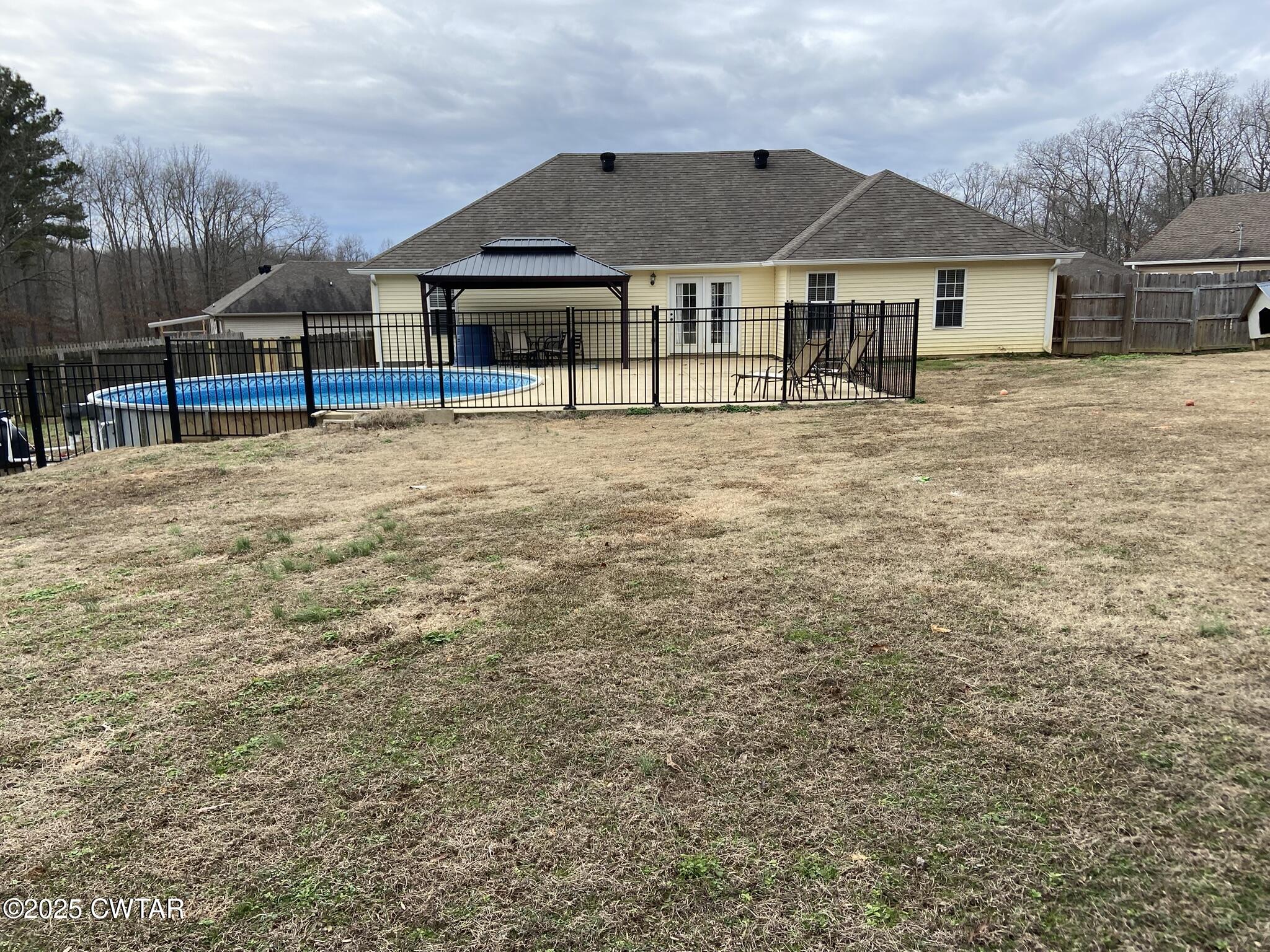 90 Timber Ridge Cove Henderson, TN 38340 - Photo 8 of 30 a view of a house with wooden deck and a big yard