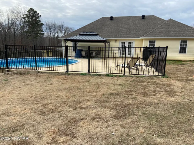 a view of a house with a fence