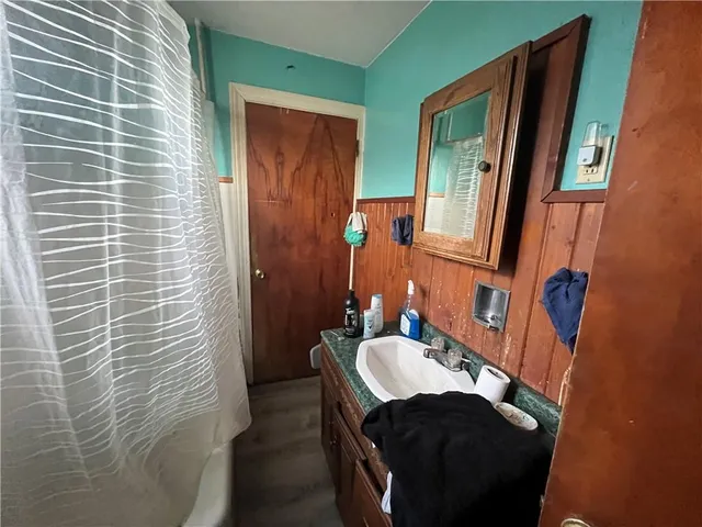 a bathroom with a sink and a mirror