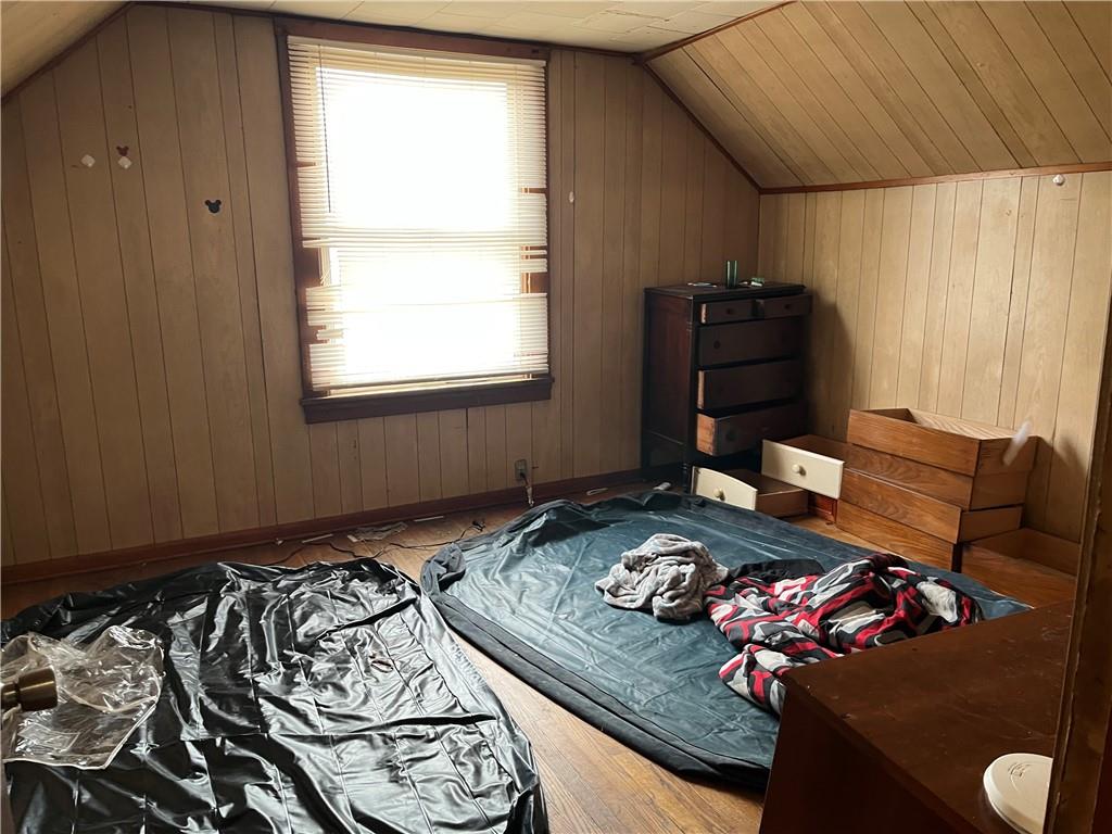 439 Malleable Street Sharon, PA 16146 - Photo 9 of 20 a bed sitting in a bedroom next to a window