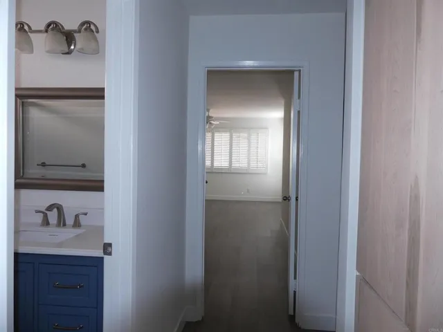 a bathroom with a sink and mirror