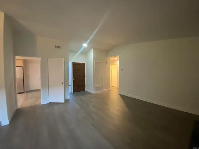 a bathroom with a sink vanity mirror and toilet