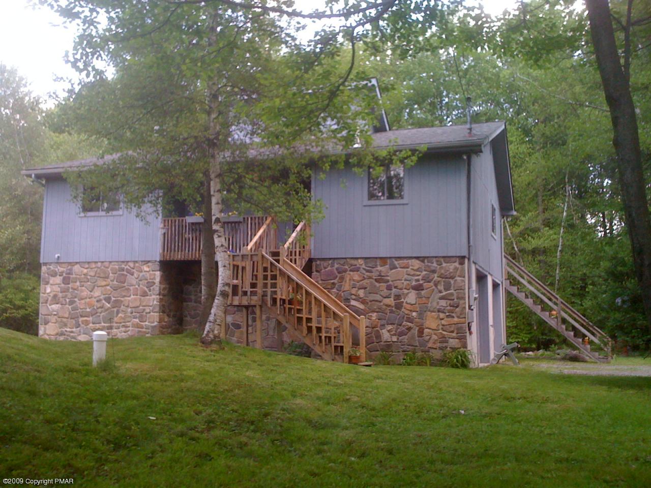 19 Spruce Road Pocono Lake, PA 18347 - Photo 4 of 17 a view of a house with a yard