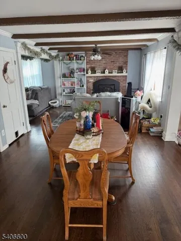 a dining room with furniture and a chandelier