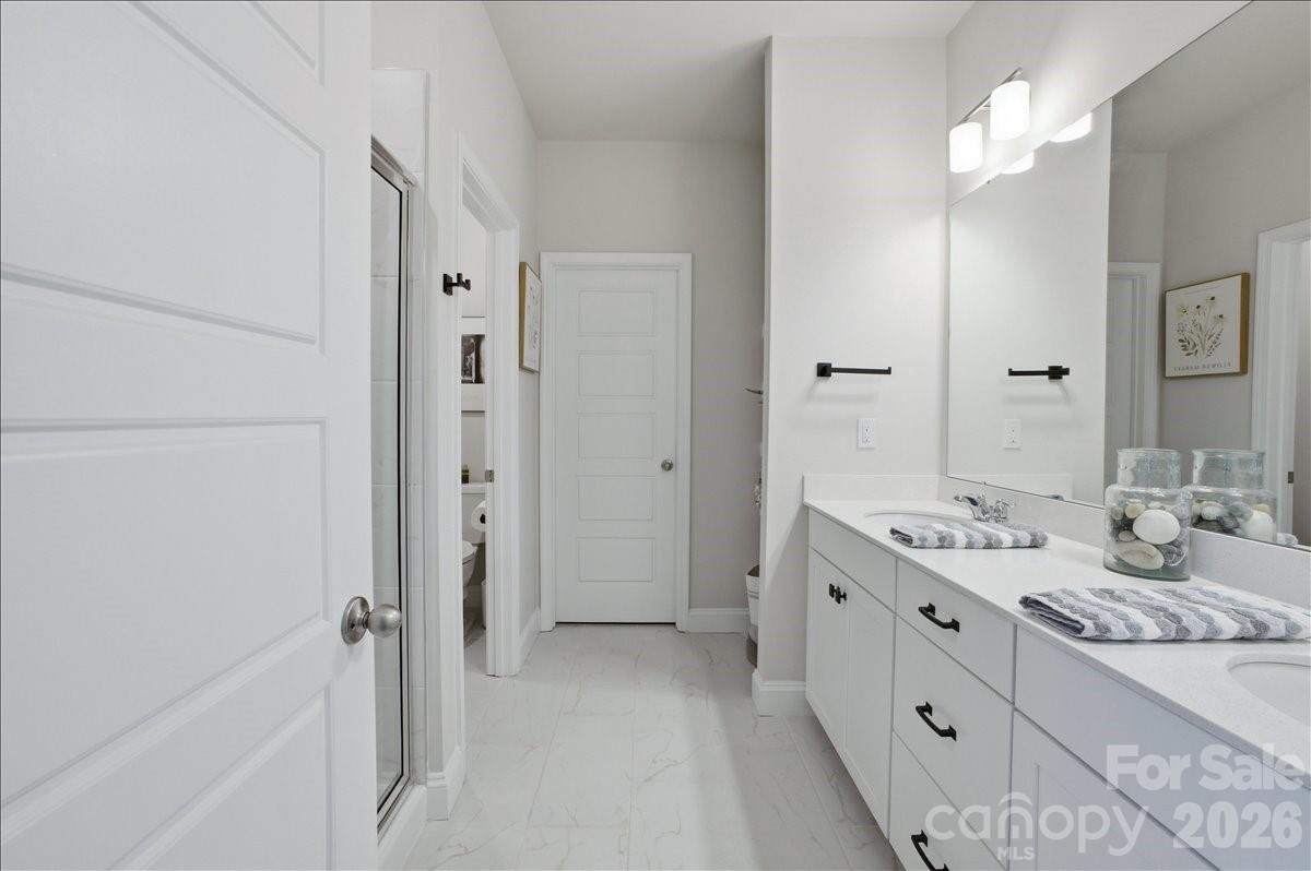 602 Banter Lane Cramerton, NC 28056 - Photo 14 of 33 a spacious bathroom with a double vanity sink mirror and double