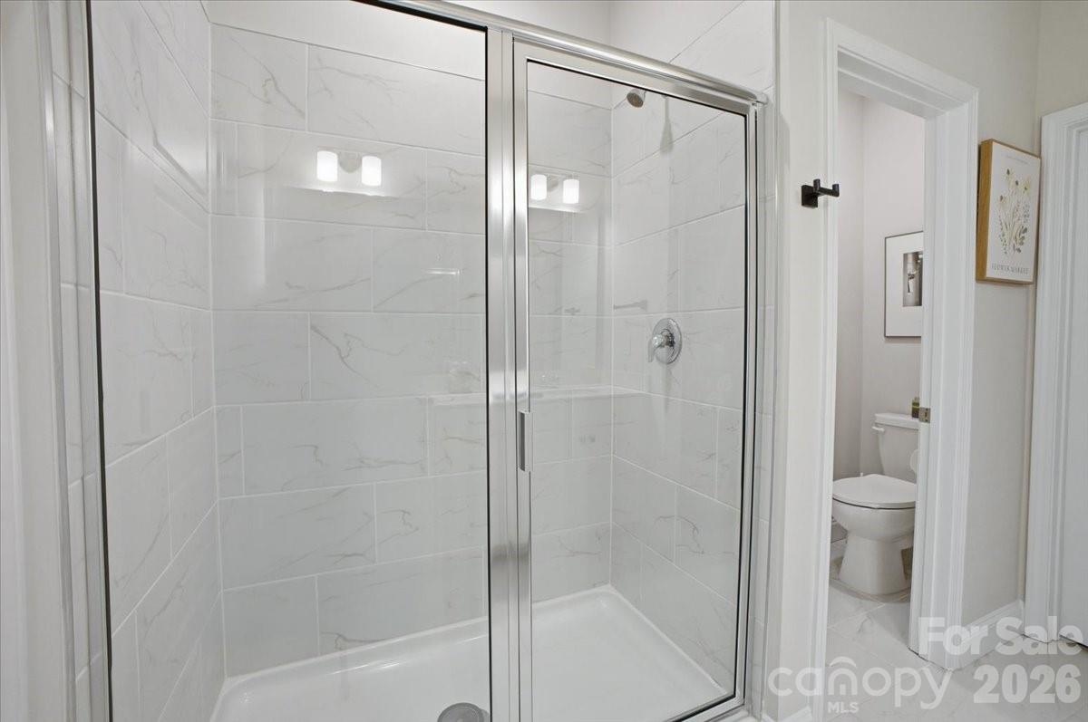 602 Banter Lane Cramerton, NC 28056 - Photo 16 of 33 a bathroom with a shower and a toilet