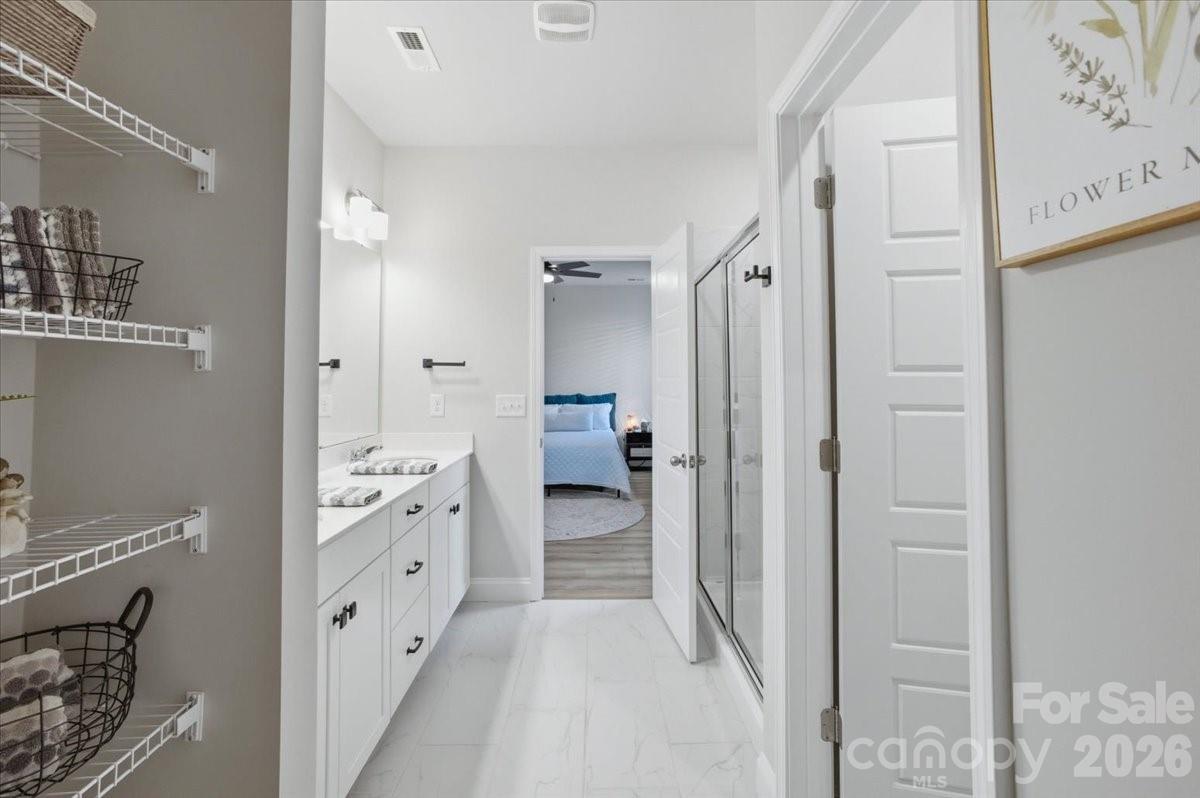 602 Banter Lane Cramerton, NC 28056 - Photo 17 of 33 a bathroom with a double vanity sink and mirror