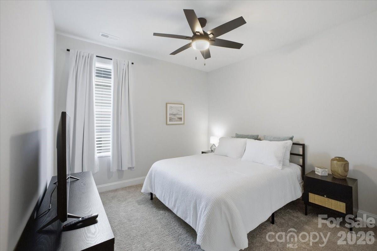 602 Banter Lane Cramerton, NC 28056 - Photo 18 of 33 a bedroom with a bed and a large window