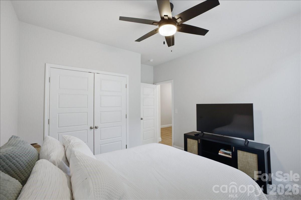 602 Banter Lane Cramerton, NC 28056 - Photo 20 of 33 a bedroom with a bed and a flat screen tv
