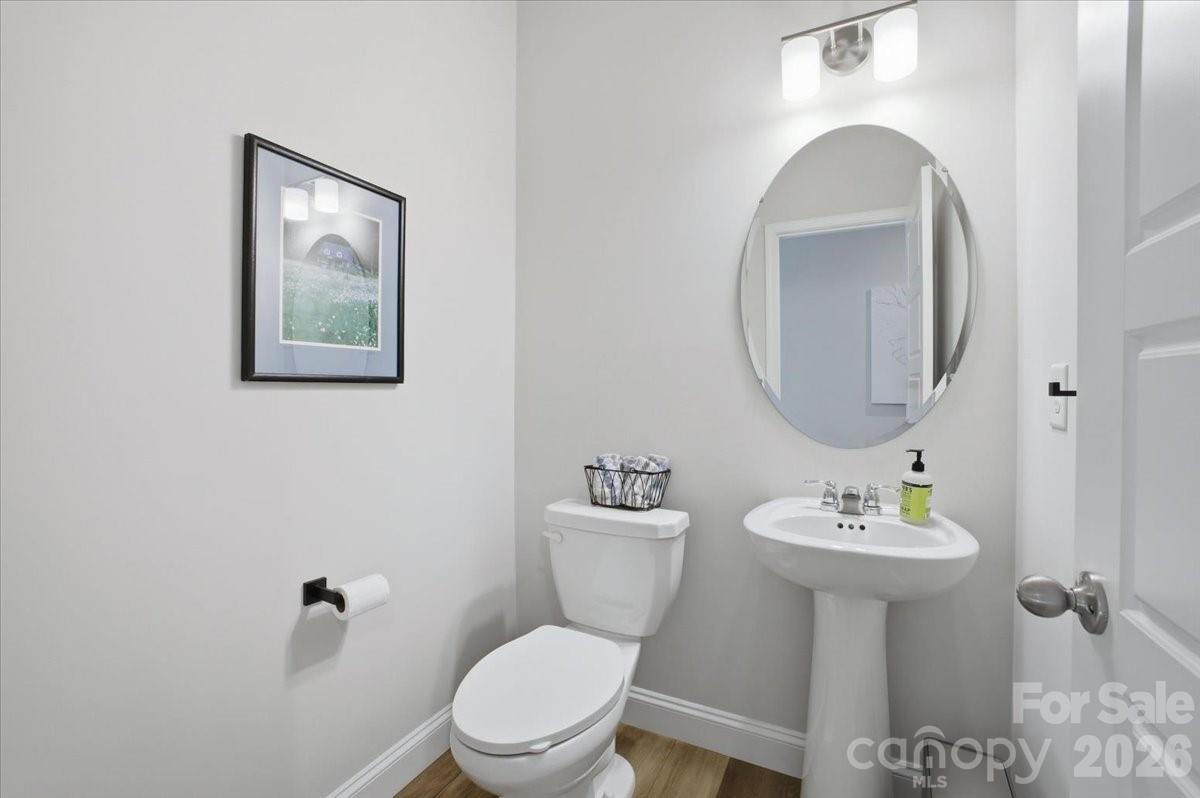 602 Banter Lane Cramerton, NC 28056 - Photo 25 of 33 a bathroom with a toilet a sink and mirror