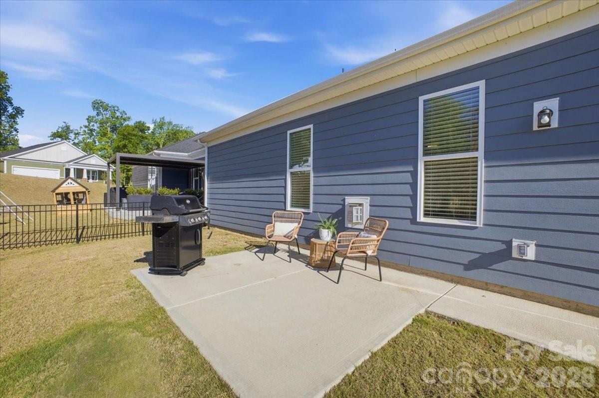 602 Banter Lane Cramerton, NC 28056 - Photo 27 of 33 a view of a patio with table and chairs with wooden fence