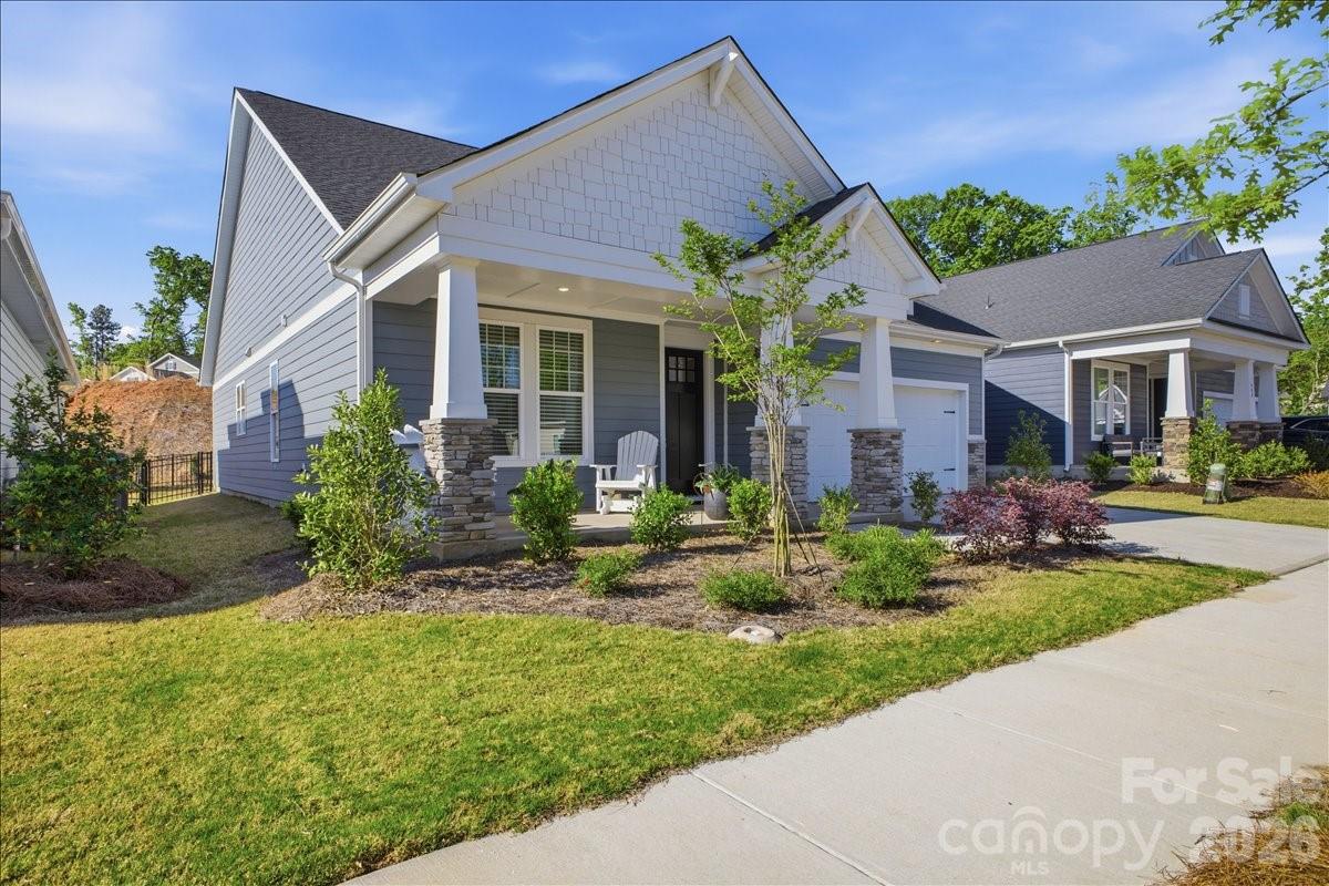 602 Banter Lane Cramerton, NC 28056 - Photo 30 of 33 a front view of a house with a yard and potted plants