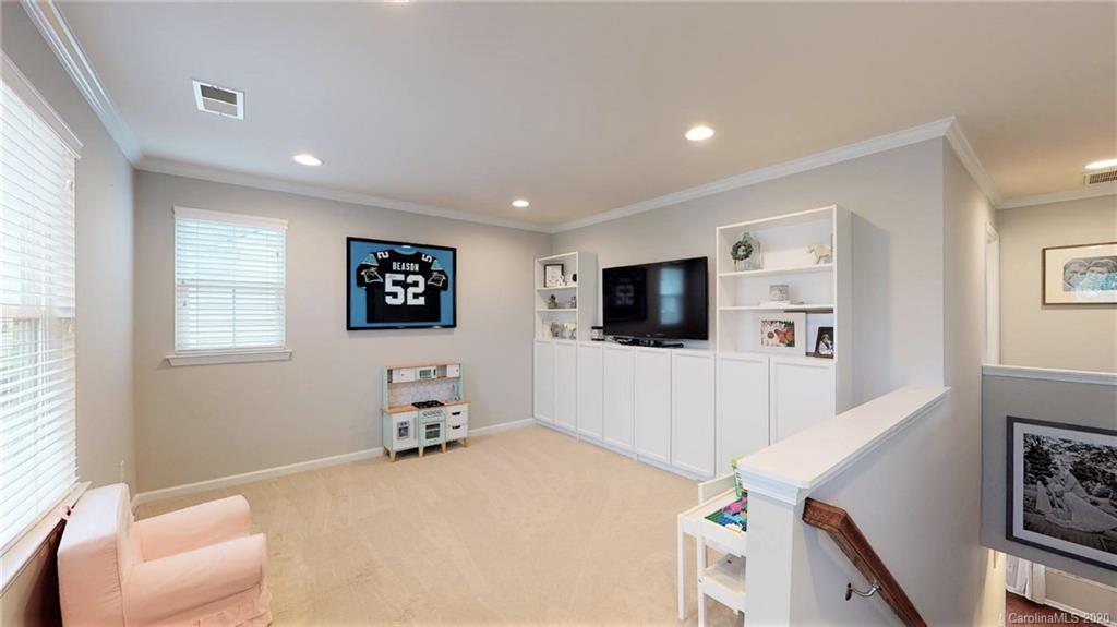 3010 Fallondale Road Waxhaw, NC 28173 - Photo 26 of 44 a living room with furniture and a flat screen tv