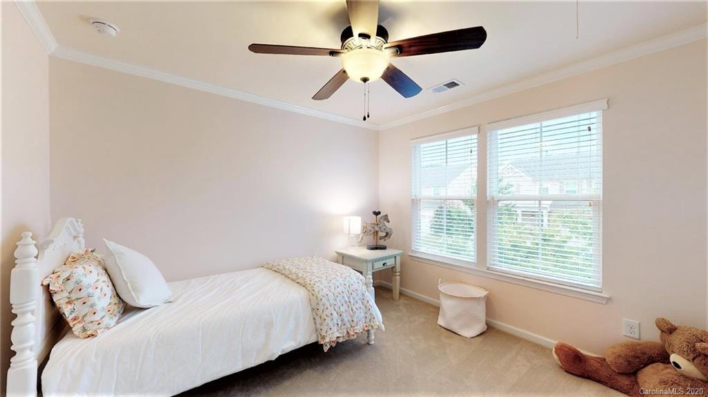 3010 Fallondale Road Waxhaw, NC 28173 - Photo 28 of 44 a bedroom with a bed and a large window