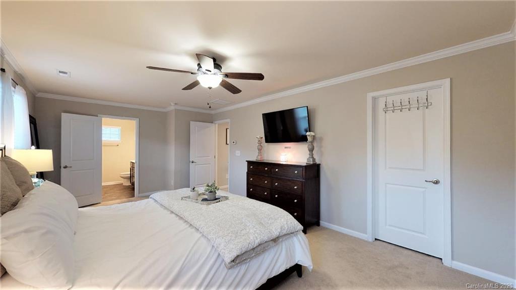 3010 Fallondale Road Waxhaw, NC 28173 - Photo 32 of 44 a bedroom with a bed and a flat screen tv