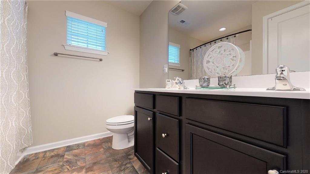 3010 Fallondale Road Waxhaw, NC 28173 - Photo 33 of 44 a bathroom with a toilet sink and mirror