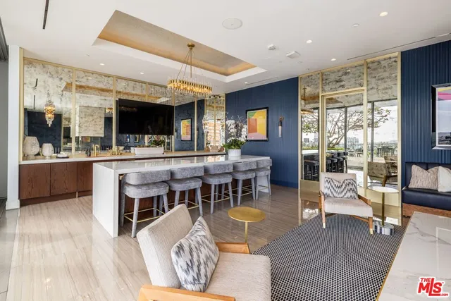 a living room with furniture a flat screen tv and a large window