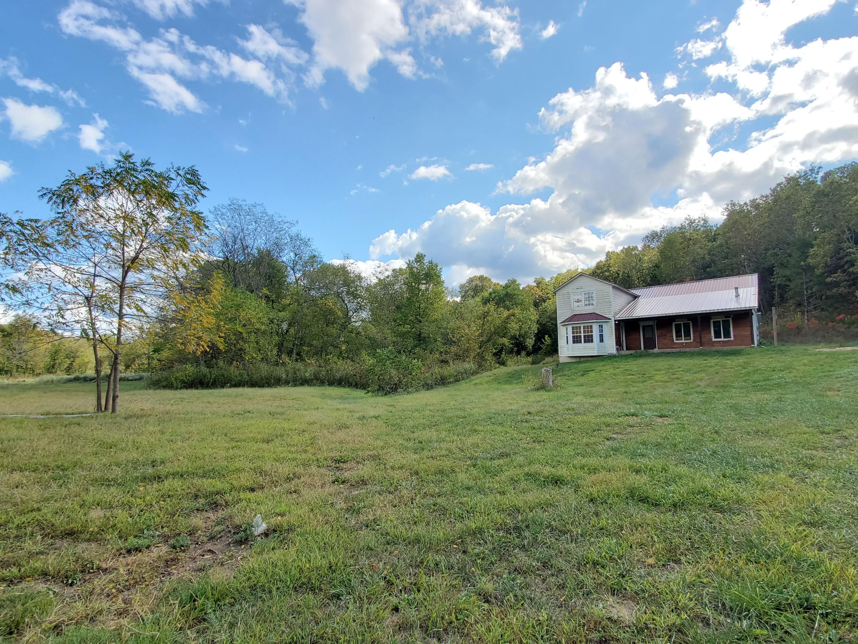 62 Rr Mansfield, MO 65704 - Photo 1 of 1 1. Home view from Pasture
