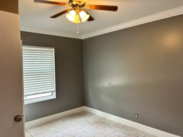 a view of an empty room with a window