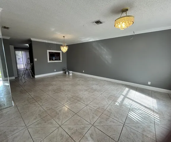 a view of an empty room and window