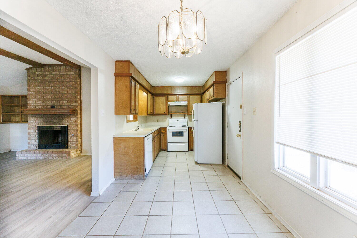 5809 Emory Street Lubbock, TX 79416 - Photo 11 of 30 a view of a kitchen with a sink and a kitchen view