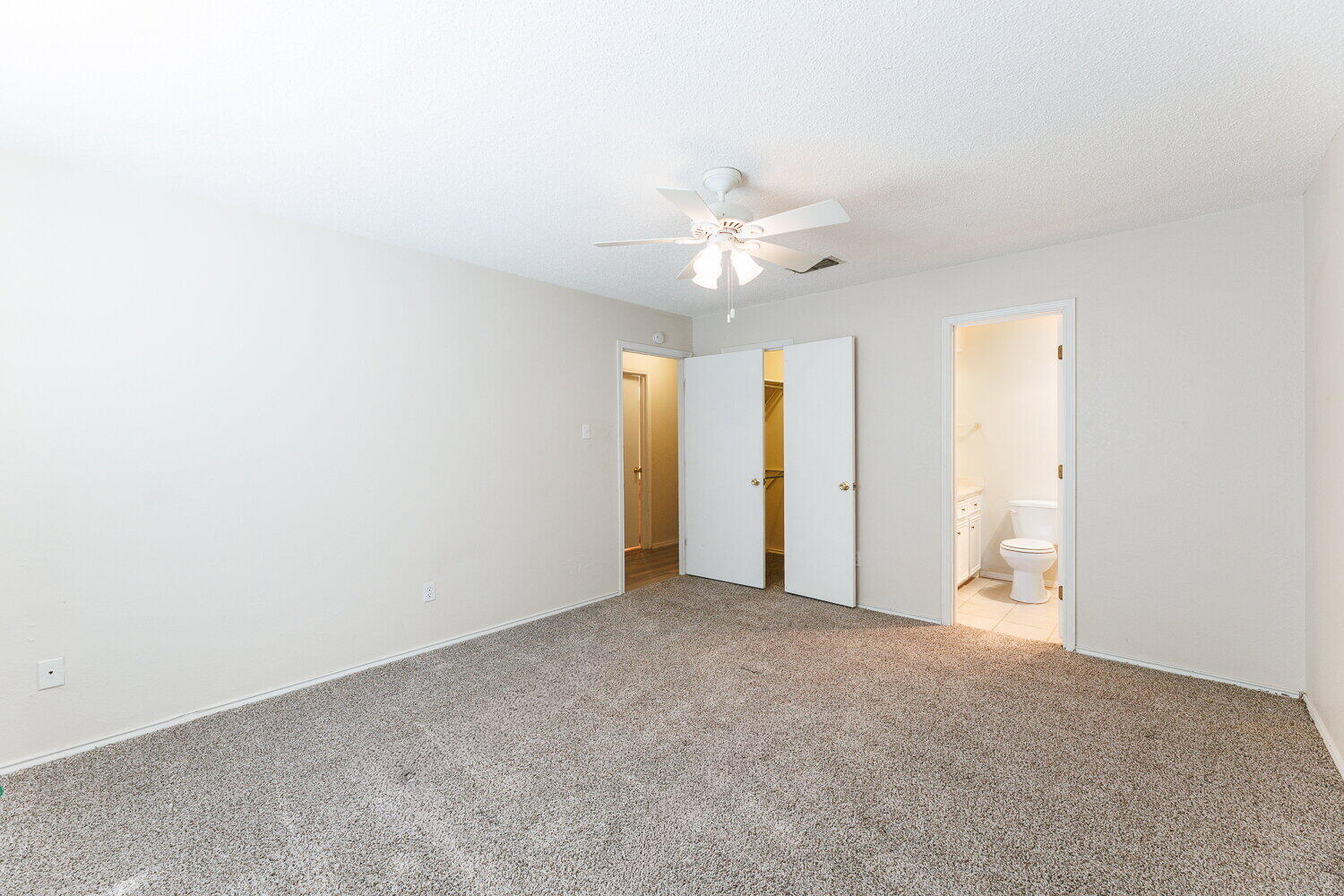5809 Emory Street Lubbock, TX 79416 - Photo 18 of 30 an empty room with a ceiling fan and a window