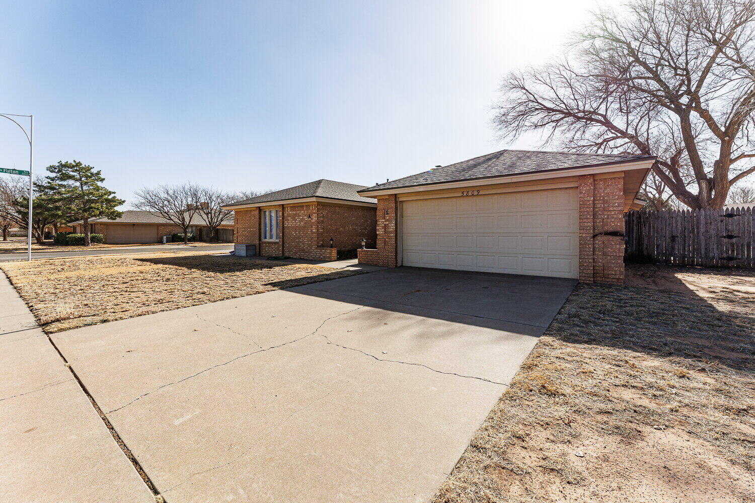5809 Emory Street Lubbock, TX 79416 - Photo 2 of 30 a view of a house with a yard