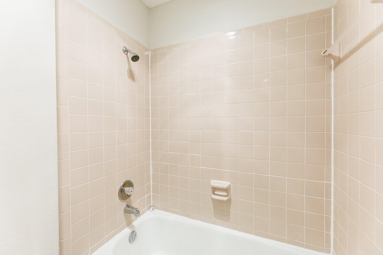 5809 Emory Street Lubbock, TX 79416 - Photo 22 of 30 a bathroom with a bathtub and shower