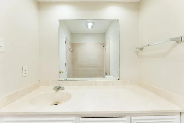 a bathroom with a bathtub and shower