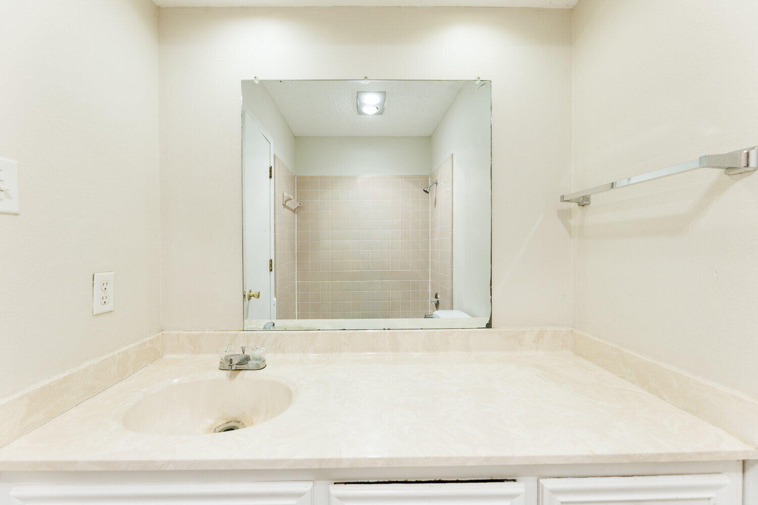 5809 Emory Street Lubbock, TX 79416 - Photo 23 of 30 a bathroom with a bathtub and shower