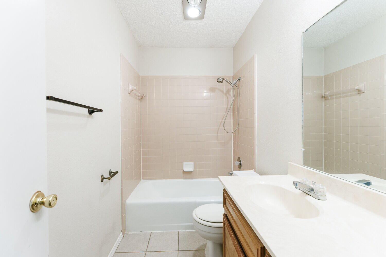 5809 Emory Street Lubbock, TX 79416 - Photo 26 of 30 a bathroom with a sink a toilet and shower