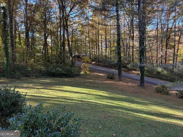 a view of a playground with basketball court