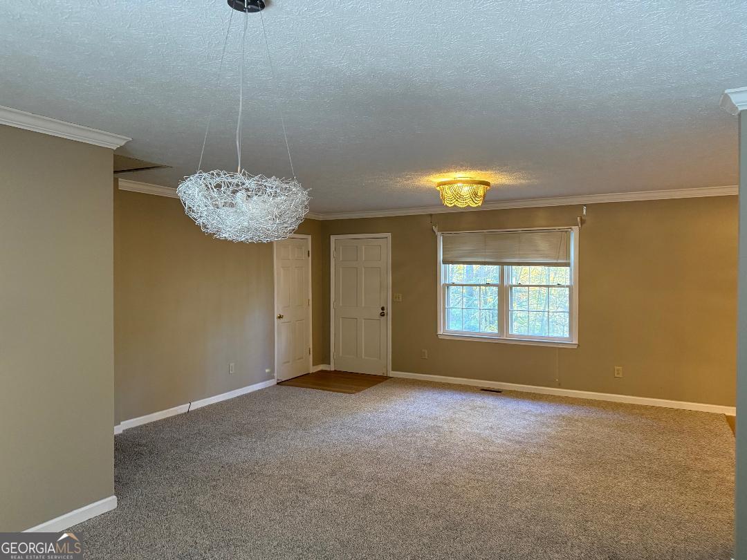 238 Settlers Point Clarkesville, GA 30523 - Photo 5 of 27 a view of an empty room with window and chandelier fan