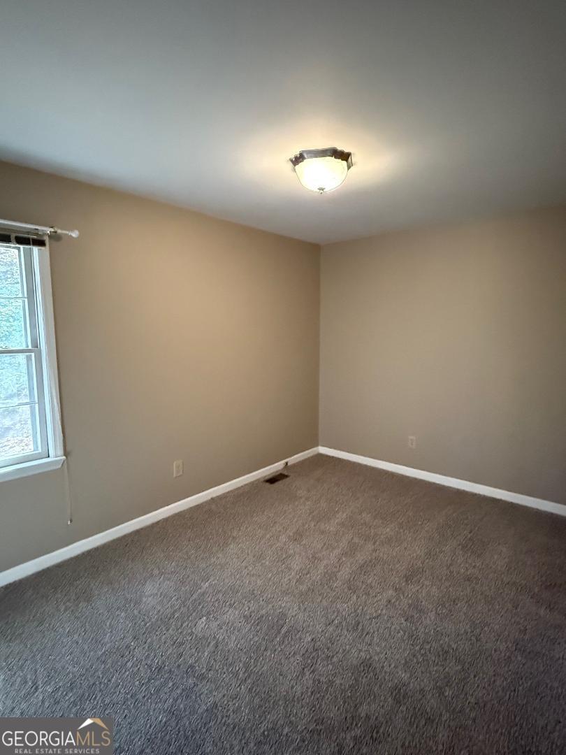 238 Settlers Point Clarkesville, GA 30523 - Photo 8 of 27 an empty room with a empty space and window